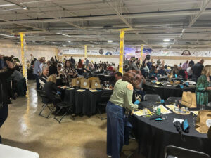 Gala Tables with attendees and gift bags on the tables